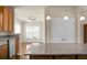Open floor plan with a view from the kitchen to the living room and featuring stainless appliances and granite countertops at 505 Eastern Isle Ave, Summerville, SC 29486
