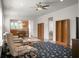 Open living room with hardwood floors, bookshelves, and access to kitchen at 505 Eastern Isle Ave, Summerville, SC 29486
