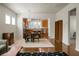 Open-concept living room with hardwood floors, dining area, and modern kitchen at 505 Eastern Isle Ave, Summerville, SC 29486