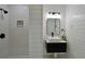 Modern bathroom with white subway tiles, black fixtures, and floating vanity at 5452 E Lakeland Dr, North Charleston, SC 29406