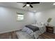 Bright bedroom features a ceiling fan, natural light and wood-look flooring at 5452 E Lakeland Dr, North Charleston, SC 29406
