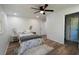 Cozy bedroom featuring a ceiling fan, natural light and wood-look flooring at 5452 E Lakeland Dr, North Charleston, SC 29406