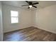 Bedroom with hardwood floors, a ceiling fan, and a window at 5452 E Lakeland Dr, North Charleston, SC 29406