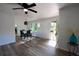 Open dining area with hardwood floors and a dining table set for a meal at 5452 E Lakeland Dr, North Charleston, SC 29406