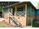 Beautiful craftsman home featuring a brick foundation and a wooden porch with decorative railings at 5452 E Lakeland Dr, North Charleston, SC 29406