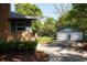 Detached two-car garage with white doors complementing the home's exterior at 5452 E Lakeland Dr, North Charleston, SC 29406