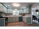 Well-lit kitchen with updated appliances, stylish countertops, and a seamless flow to the dining area, perfect for gatherings at 5452 E Lakeland Dr, North Charleston, SC 29406
