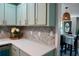 Modern kitchen with stylish backsplash, ample counter space, and adjacent dining area is ideal for entertaining guests at 5452 E Lakeland Dr, North Charleston, SC 29406