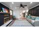 Bright living room with black brick fireplace and open access to the kitchen, creating an inviting and functional space at 5452 E Lakeland Dr, North Charleston, SC 29406