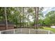 Backyard with a serene pond view and deck area, perfect for outdoor relaxation at 5496 Clearview Dr, North Charleston, SC 29420