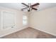 Neutral bedroom with a ceiling fan and dual windows for natural light at 5496 Clearview Dr, North Charleston, SC 29420