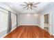 Spacious main bedroom suite with hardwood floors, large fan, tray ceiling, walk in closets and ensuite bath at 5496 Clearview Dr, North Charleston, SC 29420
