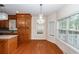 Bright dining area with a chandelier, hardwood floors, and large windows at 5496 Clearview Dr, North Charleston, SC 29420