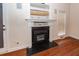 Elegant fireplace with black marble surround and a door to the exterior at 5496 Clearview Dr, North Charleston, SC 29420