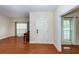 Inviting home foyer with hardwood floors and a view into the living and dining areas at 5496 Clearview Dr, North Charleston, SC 29420