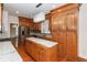 Beautiful kitchen with stainless steel appliances, a center island, custom wood cabinets, and hardwood flooring at 5496 Clearview Dr, North Charleston, SC 29420