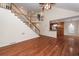 Open-concept living room with a view of the staircase and the kitchen at 5496 Clearview Dr, North Charleston, SC 29420