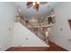 Beautiful staircase with wood railings and a view of the upper level at 5496 Clearview Dr, North Charleston, SC 29420