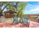 Relaxing back deck featuring a screened gazebo, marsh view and two chairs at 5703 St Angela Dr, North Charleston, SC 29418