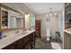 Bathroom with marble countertop, decorative vanity and toilet and decorative shelving at 5703 St Angela Dr, North Charleston, SC 29418