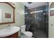 Bathroom with green walls and marble shower at 5703 St Angela Dr, North Charleston, SC 29418