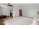 Bedroom with light blue walls, hardwood floors, and open entry to the ensuite at 5703 St Angela Dr, North Charleston, SC 29418