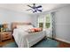 Bedroom with light blue walls, hardwood floors, and a window to outside at 5703 St Angela Dr, North Charleston, SC 29418