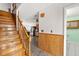 Inviting entryway with hardwood stairs and views of the kitchen at 5703 St Angela Dr, North Charleston, SC 29418