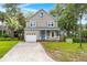Charming two-story home with a well-manicured lawn and attached garage at 5703 St Angela Dr, North Charleston, SC 29418