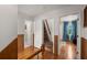 Hallway features hardwood floors and two doors to separate rooms of the house at 5703 St Angela Dr, North Charleston, SC 29418