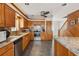 Modern kitchen with stainless steel appliances, granite counters, and ample cabinet space at 5703 St Angela Dr, North Charleston, SC 29418