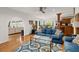 Bright living room with hardwood floors, large archway, and comfortable seating area at 5703 St Angela Dr, North Charleston, SC 29418