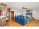 Spacious living room features a brick fireplace, hardwood floors, and a comfortable blue sofa at 5703 St Angela Dr, North Charleston, SC 29418