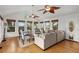 Bright sun room with vaulted ceilings, ceiling fans, and comfortable seating area at 5703 St Angela Dr, North Charleston, SC 29418