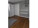 Bedroom featuring hardwood floors, built-in shelves, closet, and Mickey Mouse wall decal at 5937 Willard Dr, Hanahan, SC 29410