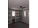 Neutral bedroom featuring striped accent wall, window, and plush gray rug at 5937 Willard Dr, Hanahan, SC 29410