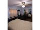Bedroom features a ceiling fan, mirror sliding closet doors, and dark wood dresser at 5937 Willard Dr, Hanahan, SC 29410