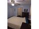Comfortable bedroom with a ceiling fan, dresser, and picture frames at 5937 Willard Dr, Hanahan, SC 29410