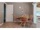 Cozy dining area features seating for four and pleasant natural lighting at 5937 Willard Dr, Hanahan, SC 29410