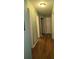 Hallway with hardwood floors leads to various rooms at 5937 Willard Dr, Hanahan, SC 29410