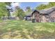 View of backyard with green lawn extending to the back of the home at 621 Temple Rd # A, Ladson, SC 29456