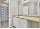 A well-lit bathroom featuring a sink with vanity, shower and tub at 621 Temple Rd # A, Ladson, SC 29456
