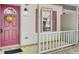 Inviting front porch with a red door adorned with a wreath, creating a warm and welcoming entrance to the home at 621 Temple Rd # A, Ladson, SC 29456