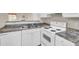 Kitchen featuring a double basin sink, white appliances, and ample counter space at 621 Temple Rd # A, Ladson, SC 29456