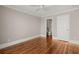 Neutral bedroom has hardwood floors with doorway that views into an en suite bathroom at 642 Harbor Creek Pl # 21, Charleston, SC 29412