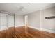 Spacious bedroom features hardwood floors, white trim, and built-in shelving at 642 Harbor Creek Pl # 21, Charleston, SC 29412