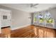 Large bedroom with hardwood floors, big windows, and adjacent bathroom at 642 Harbor Creek Pl # 21, Charleston, SC 29412
