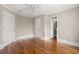 Bedroom shows hardwood floors with a doorway into a bathroom and white door and trim at 642 Harbor Creek Pl # 21, Charleston, SC 29412