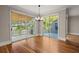 Dining room with views from the windows and sliding doors, with hardwood flooring and a chandelier at 642 Harbor Creek Pl # 21, Charleston, SC 29412