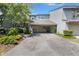 Exterior view of the home showcasing a garage and driveway with landscaped front yard at 642 Harbor Creek Pl # 21, Charleston, SC 29412